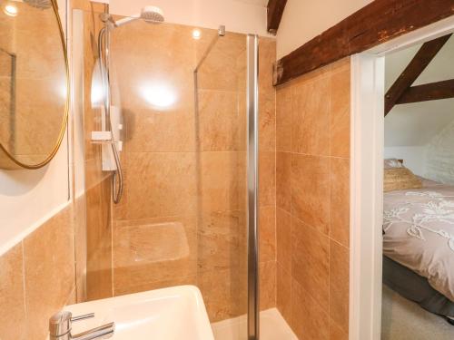 a bathroom with a shower and a sink at The Loft in Plymouth