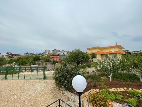 a view of a park with a building in the background at Sky Apartments in Sarandë
