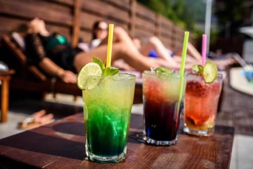 a group of three cocktails sitting on a table at Bacolux Afrodita, Herculane in Băile Herculane