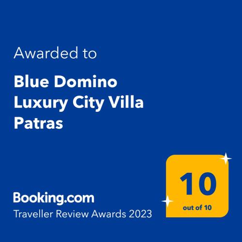 a yellow sign with the words awarded to blue dominoiny city ville at Blue Domino Luxury City Villa Patras in Patra