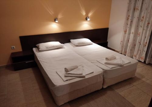a bedroom with a large bed with white sheets and pillows at Kims One-bed Apart for rent at Sunny Beach Resort in Sunny Beach