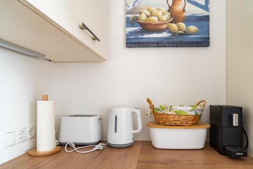 a kitchen with two coffeemakers sitting on a counter at Urlaubsoase Hügelperle in Bad Gleichenberg