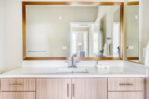a bathroom with a sink and a large mirror at Mountain View 1BR w Pool Gym nr Target TJ SFO-590 in Mountain View