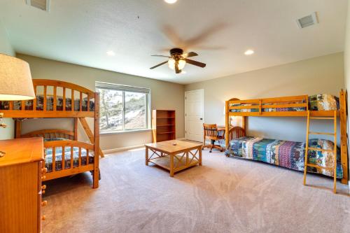 a bedroom with bunk beds and a ceiling fan at South Lake Tahoe Home with Deck and Gas Grill! in South Lake Tahoe