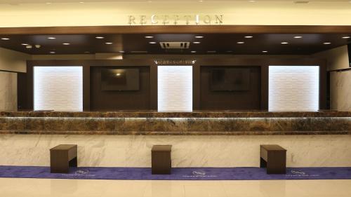 a lobby of a hotel with a reception counter at Toyoko Inn Omiya-eki Higashi-guchi in Saitama