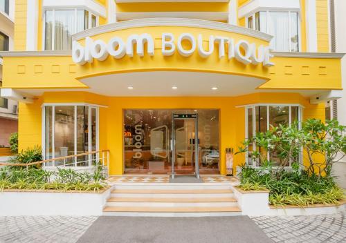 a yellow building with a sign that reads bloom boutique at Bloom Boutique - Connaught Place Area in New Delhi