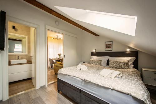 Postel nebo postele na pokoji v ubytování Apartman I & J
