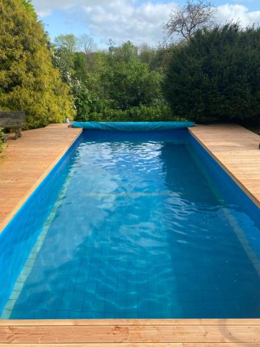 a swimming pool with blue water at Ferienhof Kröger in Bielefeld