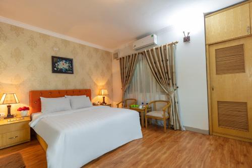 Een bed of bedden in een kamer bij Blau Hotel