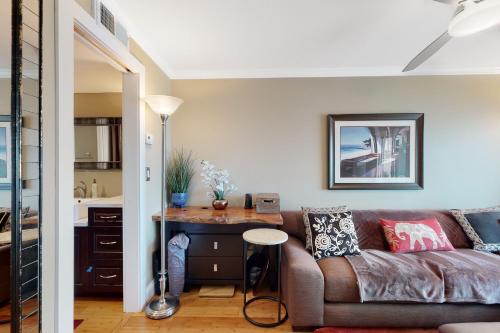 a living room with a couch and a table at Rehoboth Beach --- Star of the Sea #604 in Rehoboth Beach