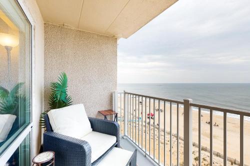 a balcony with a chair and a view of the beach at Rehoboth Beach --- Star of the Sea #604 in Rehoboth Beach