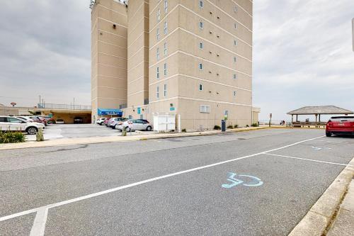 an empty parking lot in front of a large building at Rehoboth Beach --- Star of the Sea #604 in Rehoboth Beach
