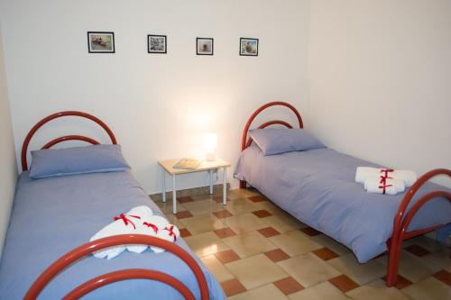 A bed or beds in a room at Agrigento CityCenter