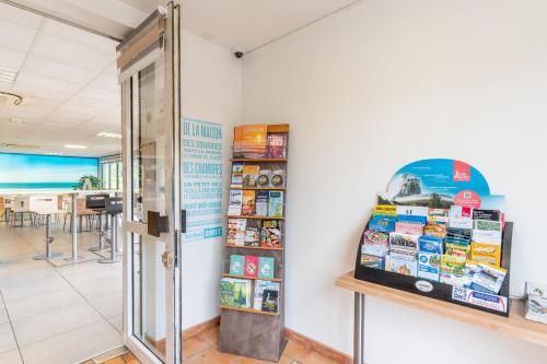 a shop with a display case in a room at Kyriad Direct Bordeaux Sud Cestas in Cestas