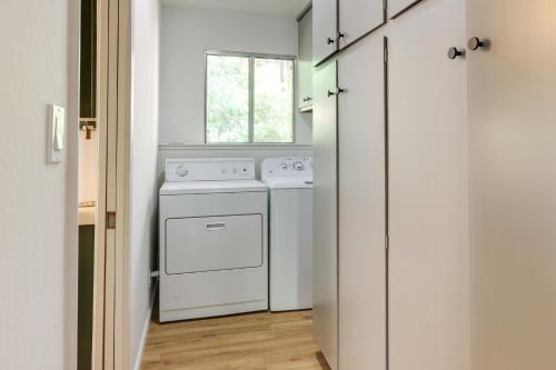 a kitchen with a white stove and a window at Deck and Fire Pit Stunning Twain Harte Cabin! in Twain Harte