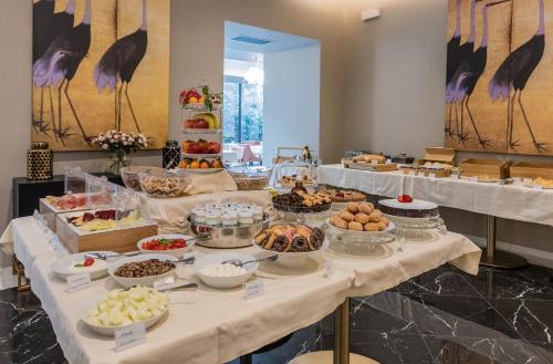 a buffet table with many different types of food at Hotel Astoria in Genova
