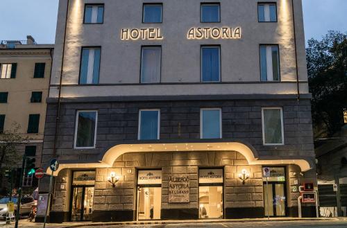 a building with a hotel astoria in front of it at Hotel Astoria in Genova