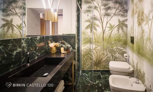 a bathroom with a sink and a toilet at Albergo Diffuso Birkin Castello in Cagliari
