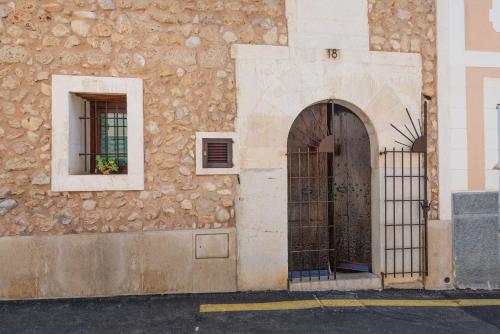 an entrance to a building with a door and a window at Casa del Sol in Búger