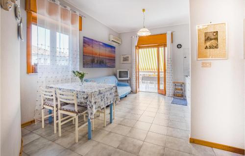 a kitchen and dining room with a table and chairs at Archirafi House in Riposto