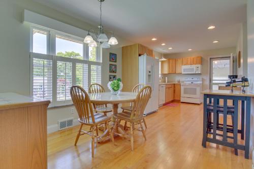 a kitchen with a table and chairs in a kitchen at Home with Hot Tub and Deck about 3 Mi to Ark Encounter! in Williamstown