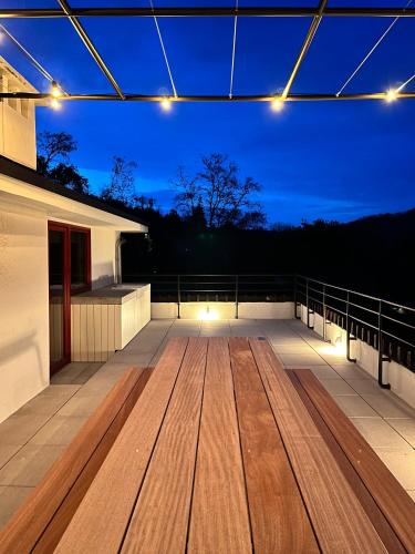 a large deck with lights on top of a house at Villa Michaux in Hastière-par-delà