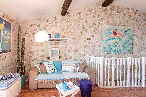 a living room with a couch and a crib at A9 - 1 BDR Fantastic Sea View Remparts Old Antibes - AC in Antibes