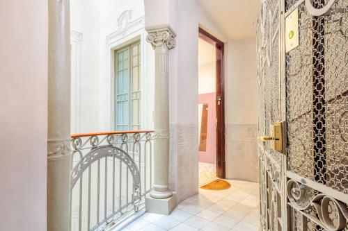 a door to a balcony with a gate at Barcelonaforrent The Gaudí Suites in Barcelona