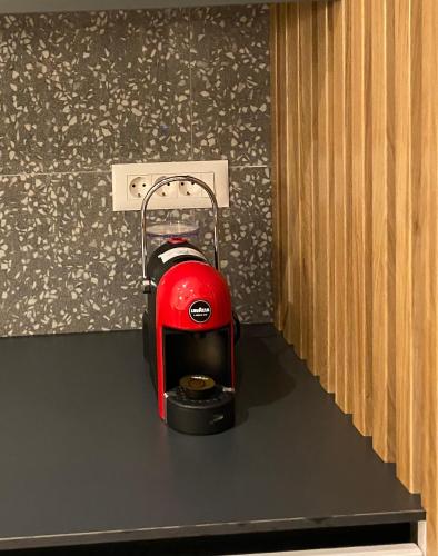 a red toaster sitting on top of a counter at Modern Mountain La Stella in Kolašin