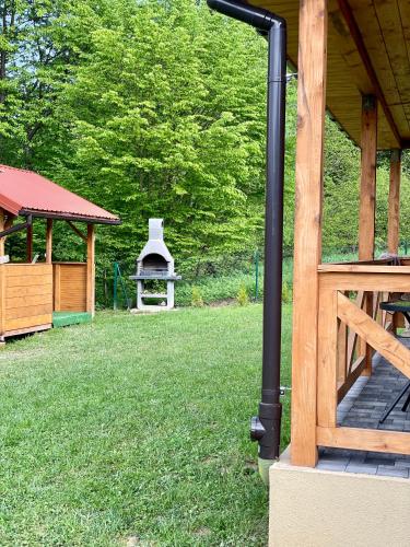 a gazebo with a gazebo with a gazeb at Borówkowy Jar in Ropienka