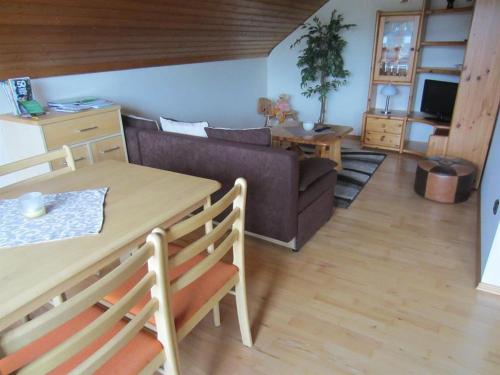 a living room with a couch and a table at Ferienwohnung Freitag in Winsen