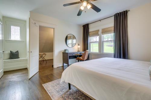 a bedroom with a large bed with a ceiling fan at Pet-Friendly Cincinnati Retreat with Hot Tub in Blue Ash