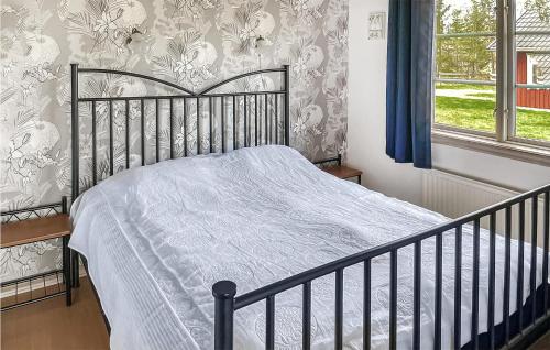 En eller flere senge i et værelse på Beautiful home in Vittaryd with 2 Bedrooms and WiFi