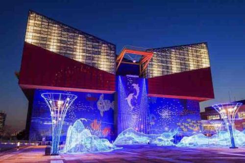 a building with blue lights in front of it at 帝塚山忍者屋敷 in Osaka