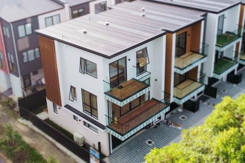 an overhead view of a house with a roof at Luxury Brand New Designer Living in Auckland
