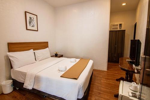 Katil atau katil-katil dalam bilik di Kiwi Hotel