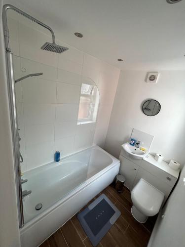 a bathroom with a shower and a toilet at Charming Liverpool Home in Liverpool
