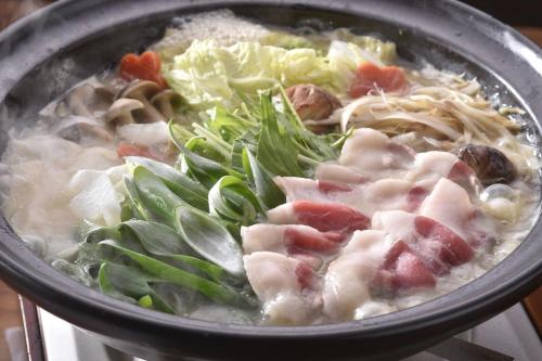 a bowl of soup with meat and vegetables in it at Ryokan Sumiya Kihoan in Kameoka