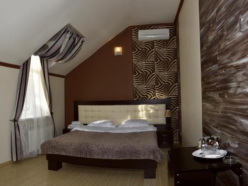 Cama o camas de una habitación en Rostov Hotel