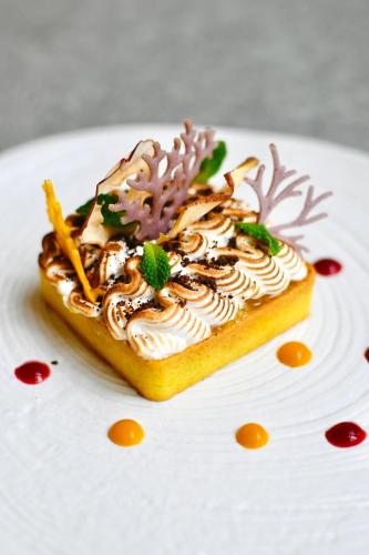 a piece of cake on a white plate at Hotel Sokół Wellness & SPA in Łańcut