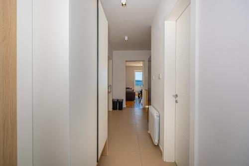 a hallway of a house with white walls at Villa Veronika Apartments in Crikvenica
