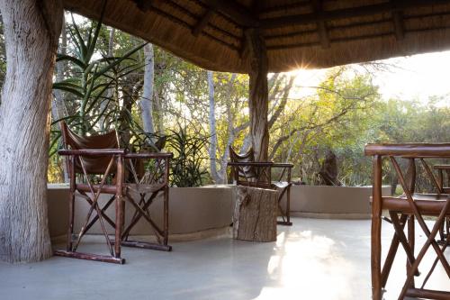 two chairs sitting on top of a porch at MILIMA Big 5 Safari Lodge in Hoedspruit