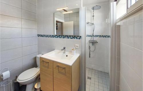 a bathroom with a toilet and a sink and a shower at Stunning Home In Saint-nazaire With Wifi in Saint-Nazaire