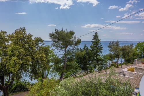 a view of the ocean from a house at Villa Veronika Apartments in Crikvenica