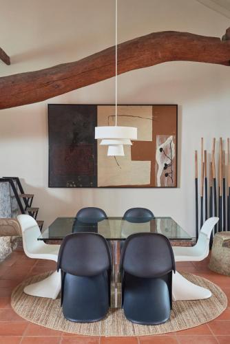a dining room with a glass table and chairs at Luxury Farmhouse with Swimming Pool, By TimeCooler in Sobral de Monte Agraço