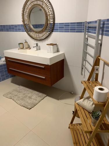 a bathroom with a sink and a mirror at Vivenda do Cielo in Salga