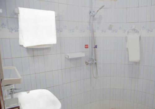a bathroom with a shower and a toilet at Amariah Villa in Kigali