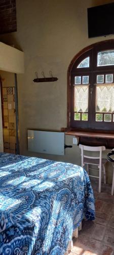 Ένα ή περισσότερα κρεβάτια σε δωμάτιο στο Casita de Piedra B&B