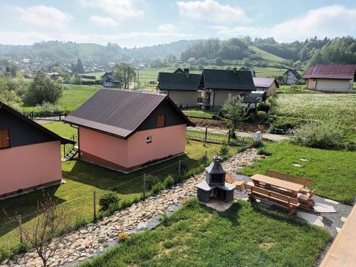 an aerial view of a village with houses and a bench at Motylowe Wzgórze Apartamenty Zawóz in Zawóz