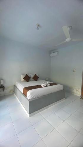 Ένα ή περισσότερα κρεβάτια σε δωμάτιο στο Murni house